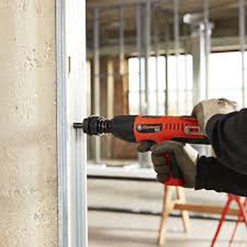 Powder actuated tool in use